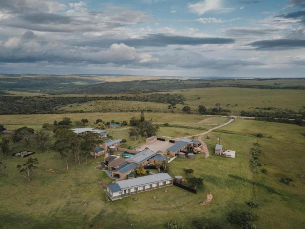 an aerial view of a large house in a field at Umbono Private Game Lodge in Alexandria