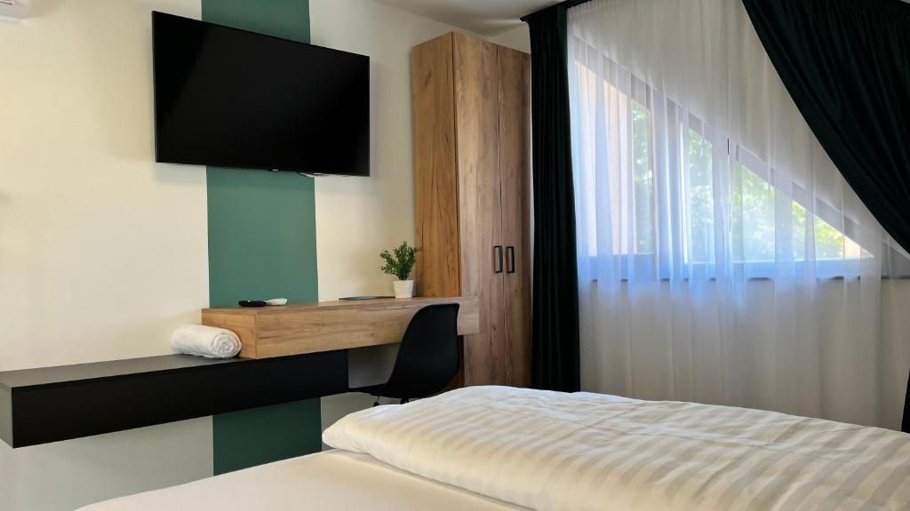 Postel nebo postele na pokoji v ubytování Rezidex Apartmanház