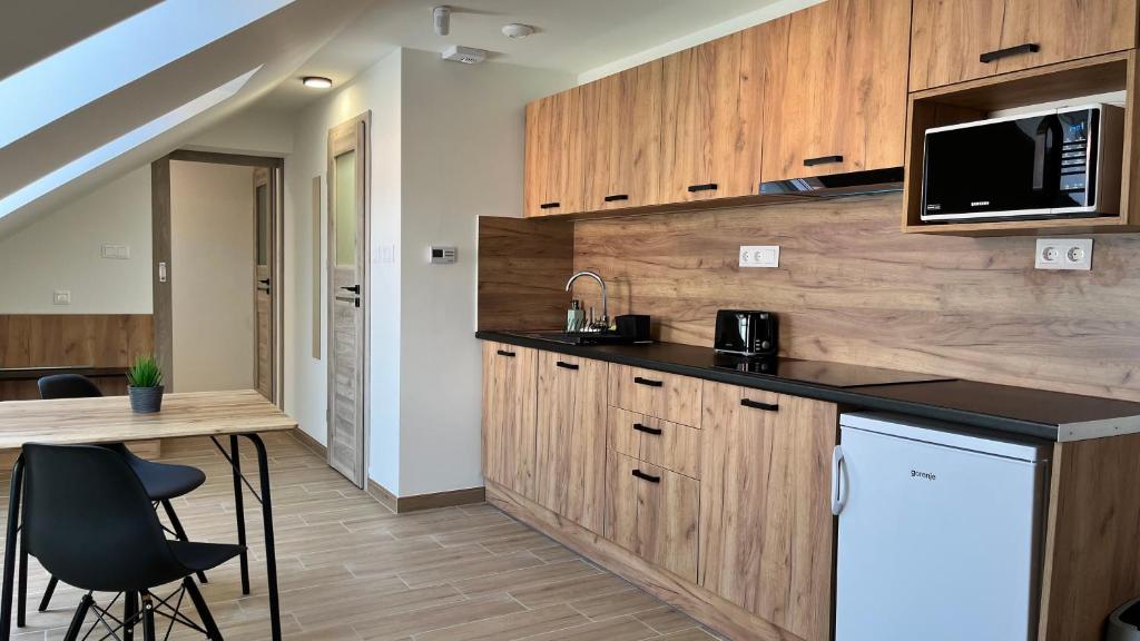 Kuchyň nebo kuchyňský kout v ubytování Rezidex Apartmanház