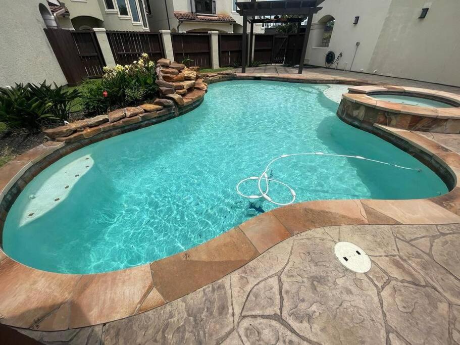 a swimming pool in a house with a pool at BAIZA mini castle in the Galleria in Houston