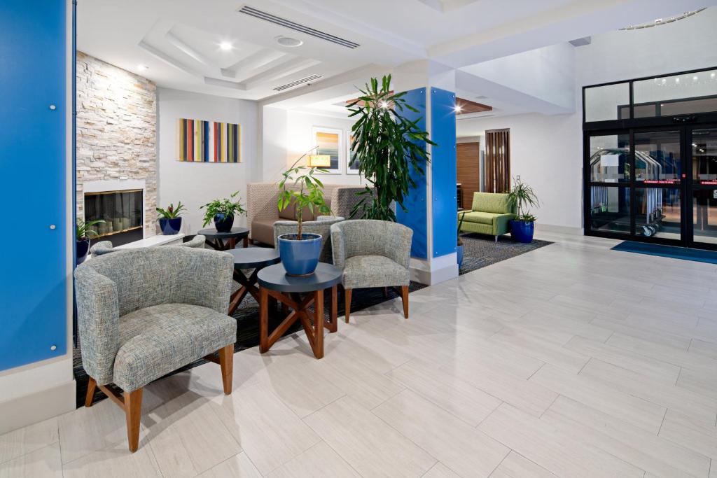 an office lobby with chairs and a table at Holiday Inn Express Hotel & Suites Atascadero, an IHG Hotel in Atascadero