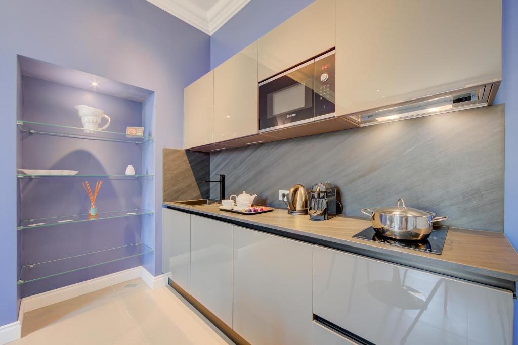 Kuchyň nebo kuchyňský kout v ubytování Seven Suites Apartments - Via Matteotti 178