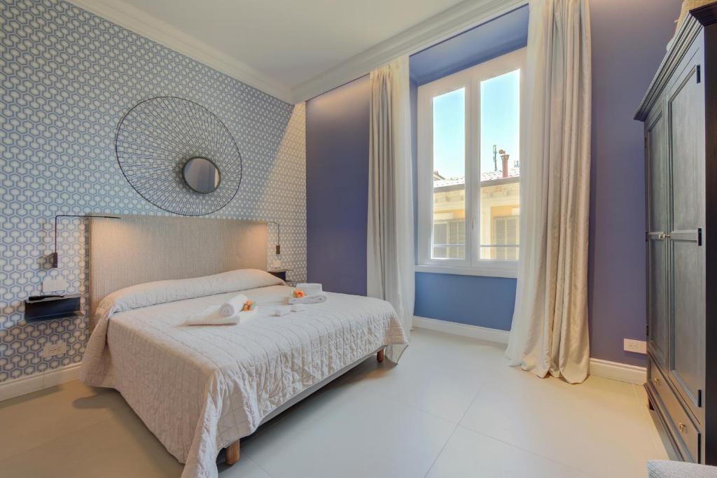 Postel nebo postele na pokoji v ubytování Seven Suites Apartments - Via Matteotti 178