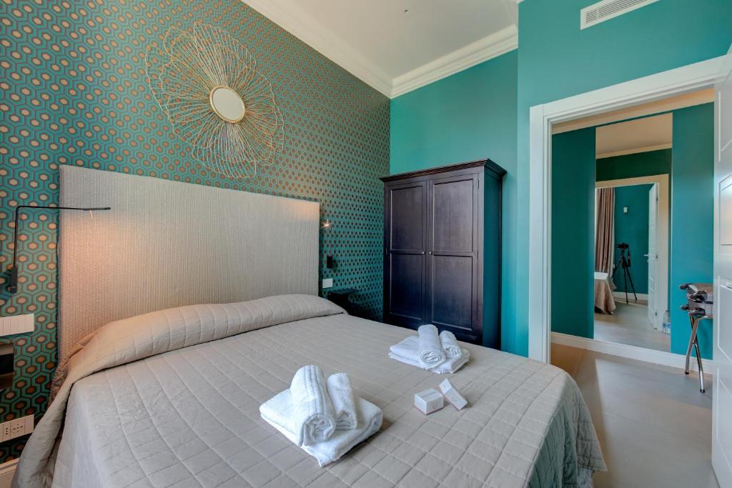 Postel nebo postele na pokoji v ubytování Seven Suites Apartments - Via Matteotti 178