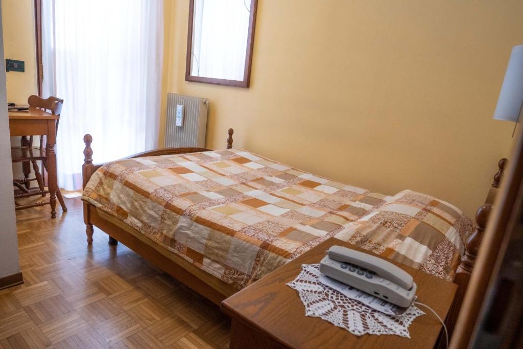 Postel nebo postele na pokoji v ubytování Albergo Nuoitas