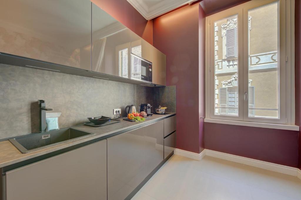 Kuchyň nebo kuchyňský kout v ubytování Seven Suites Apartments - Via Matteotti 178