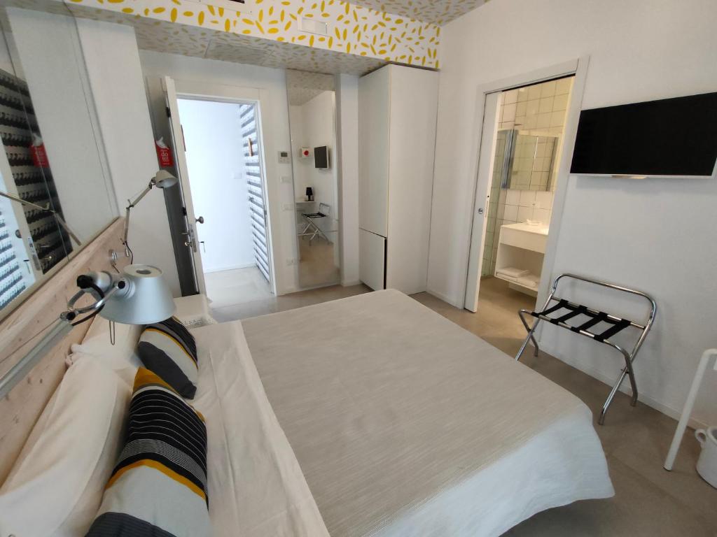 Postel nebo postele na pokoji v ubytování QuiHotel