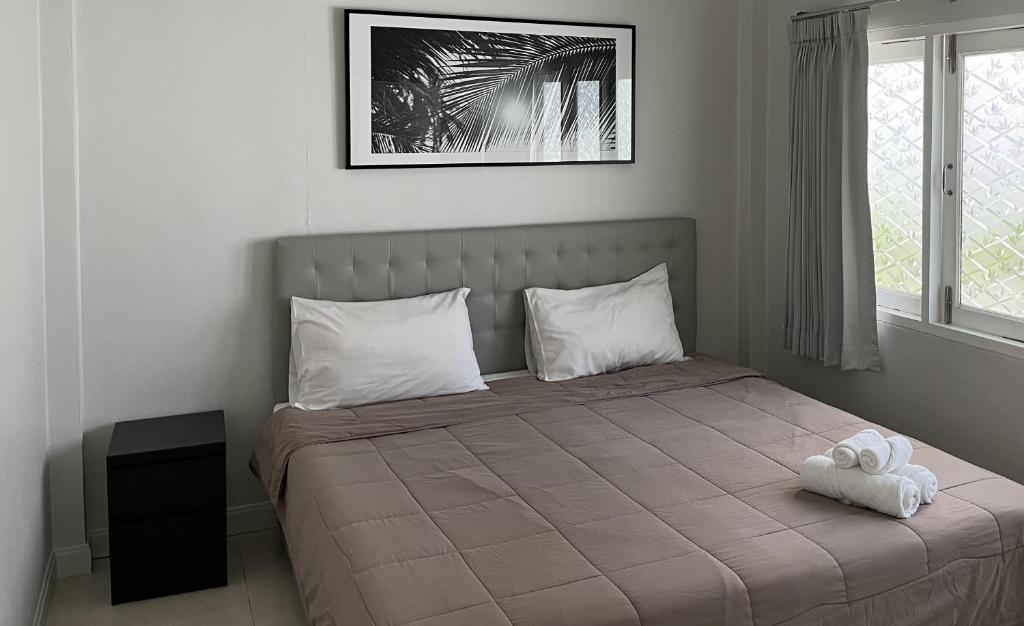 Postel nebo postele na pokoji v ubytování Bann Kanchana Beachfront Villas