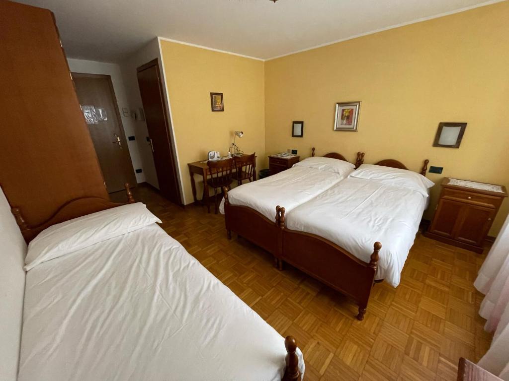 Postel nebo postele na pokoji v ubytování Albergo Nuoitas
