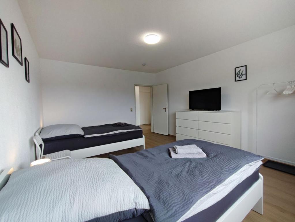 Postel nebo postele na pokoji v ubytování ERB01 - 2-Zimmer-Apartment mit Balkon in Bad König
