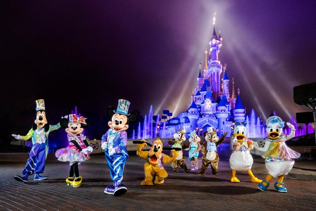 a group of performers in front of a disney castle at House with garden Disneyland Paris in Magny-le-Hongre