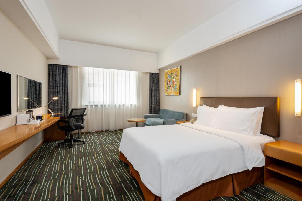 Postel nebo postele na pokoji v ubytování Holiday Inn Express Shanghai New Jinqiao by IHG