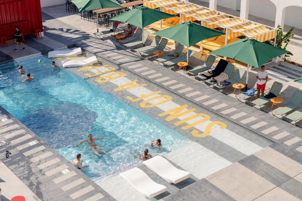 an overhead view of a swimming pool with people in it at Ryans Lolas - Adults Only in San Antonio Bay