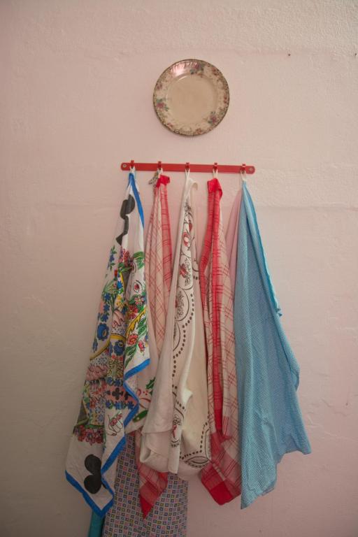 a group of ties hanging on a wall at Sintra Small Hostel in Sintra