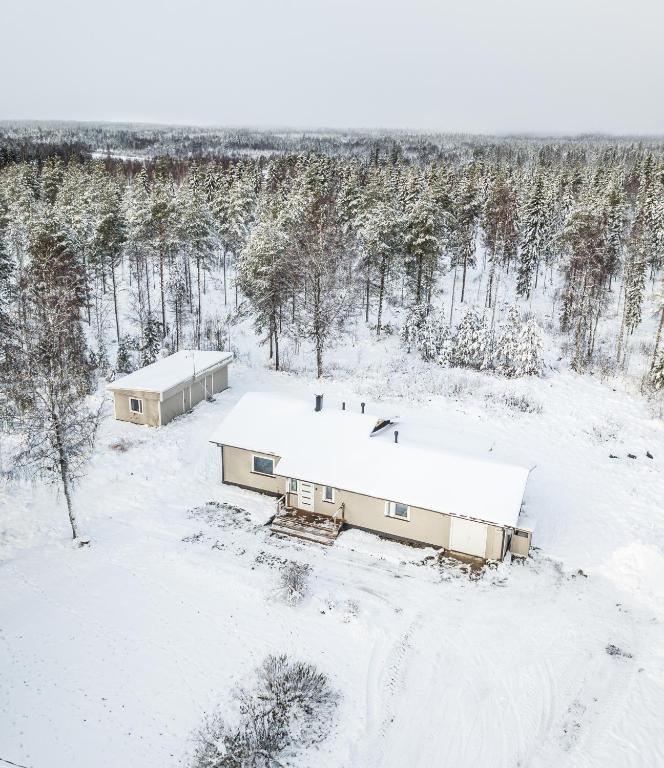 an aerial view of two buildings in the snow at Ranua Haistila Retreat with Elegant Views & Sauna near Rovaniemi in Ranua