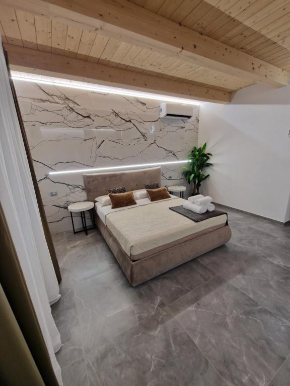 Postel nebo postele na pokoji v ubytování MARLA ROOMS