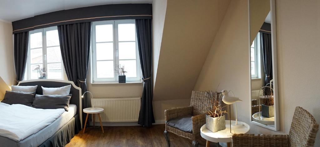Postel nebo postele na pokoji v ubytování Rein Klassik Hotel