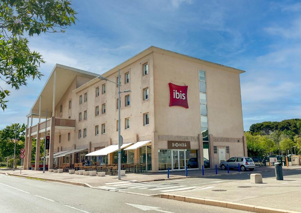 a large building with a ups sign on it at ibis Martigues Centre in Martigues