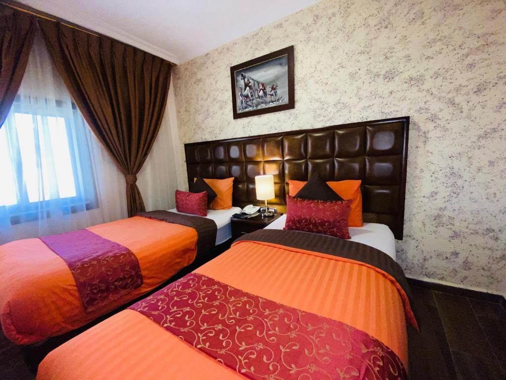 Postel nebo postele na pokoji v ubytování Anbat Midtown Hotel