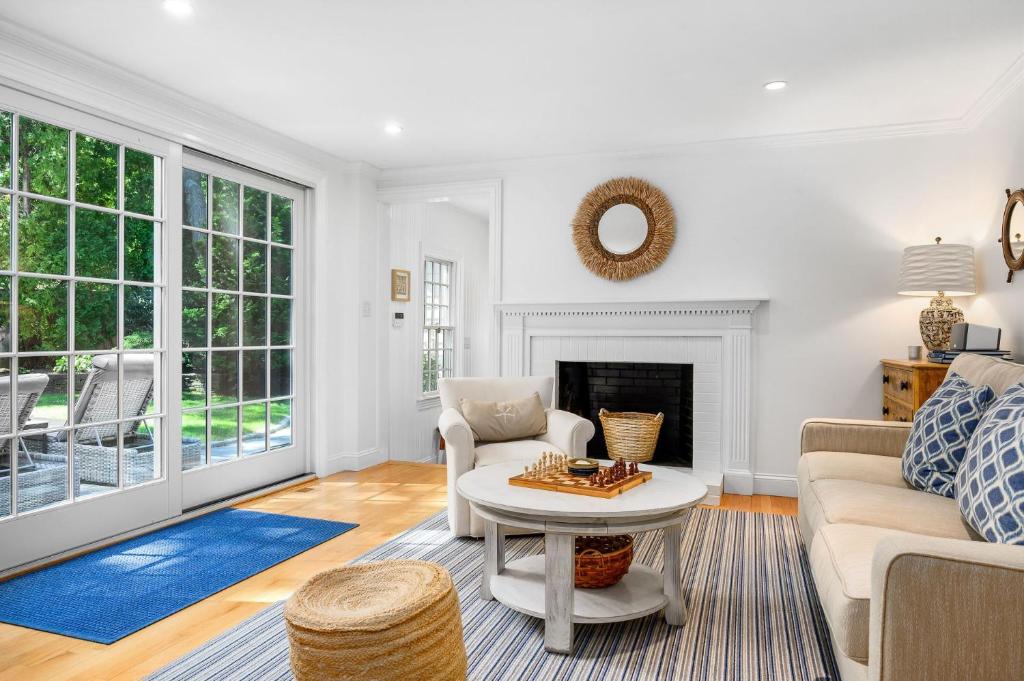 a living room with a couch and a table at 55 Wianno Circle Osterville - O Captain My Captain in Osterville