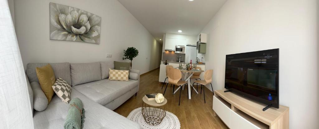 Televízia a/alebo spoločenská miestnosť v ubytovaní Canteras Suite Gran Canaria