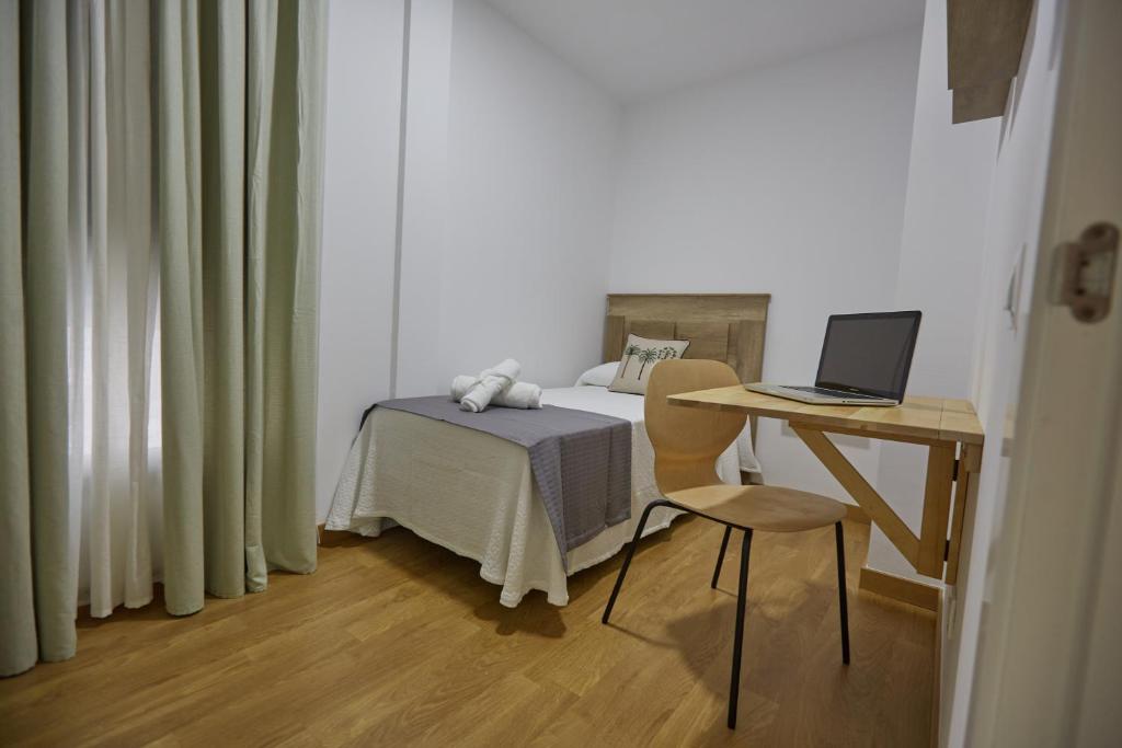 Posteľ alebo postele v izbe v ubytovaní Canteras Suite Gran Canaria