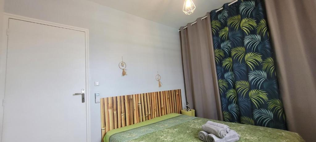 Postel nebo postele na pokoji v ubytování VILLA CARAIBES vue mer exceptionnelle