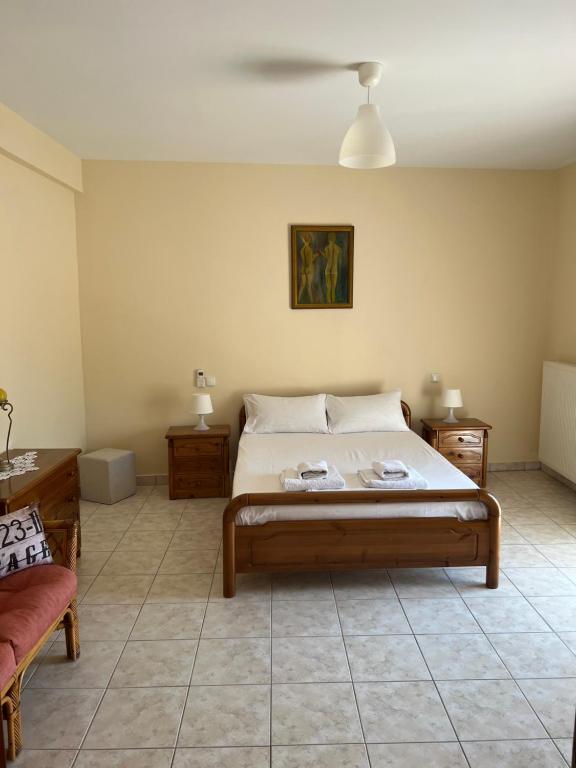 Postel nebo postele na pokoji v ubytování Alexandra' s Apartments
