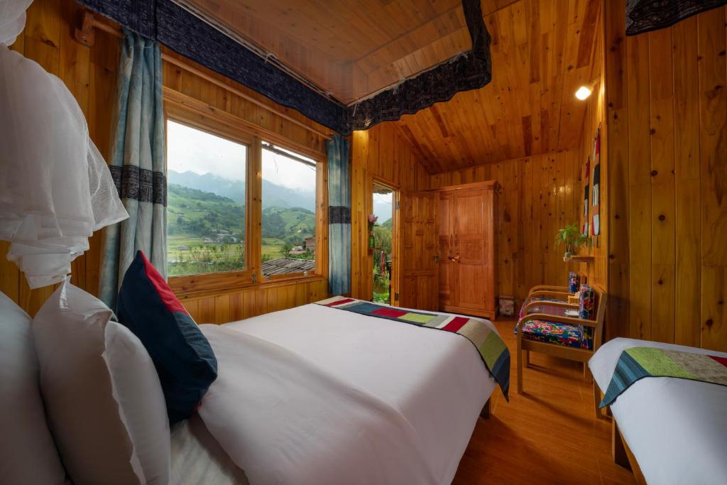 Postel nebo postele na pokoji v ubytování SaPa Farmer House