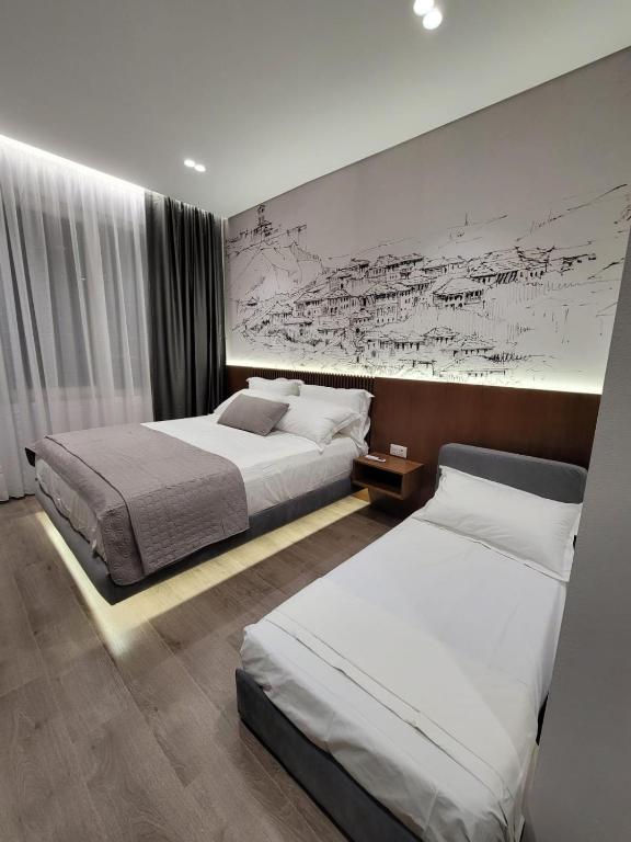 Postel nebo postele na pokoji v ubytování Jani Studio Apartments