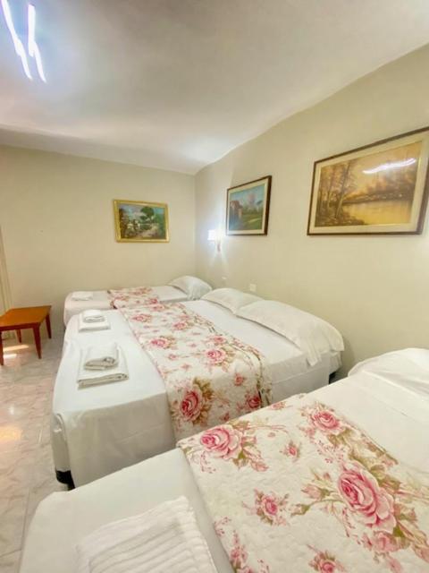 Postel nebo postele na pokoji v ubytování Hotel Resi