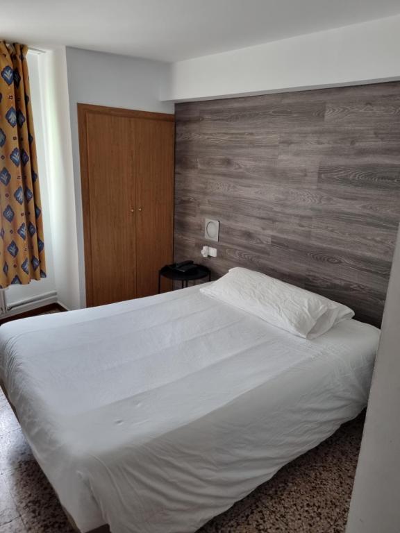 Giường trong phòng chung tại Hotel Cims Pas de La Casa
