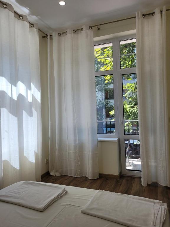 Postel nebo postele na pokoji v ubytování The House - Central Boutique Apartments