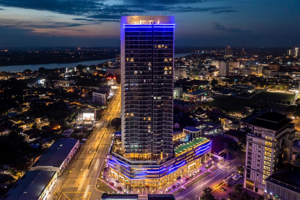 a tall building with blue lights on top of it at One Bedroom Troika Residence Suite 22-10 in Kota Bharu