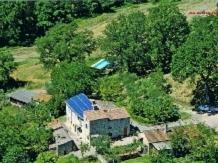 an aerial view of a house with a blue roof at Domus Etrusca in San Casciano dei Bagni