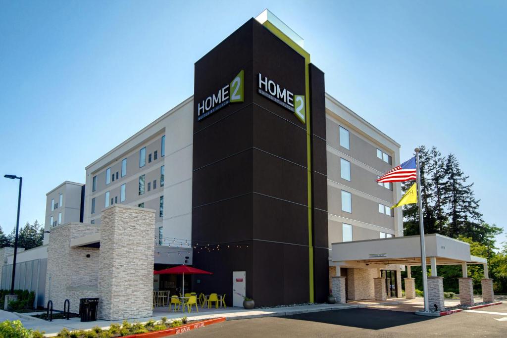 a rendering of the front of a hotel at Home2 Suites By Hilton Marysville in Marysville