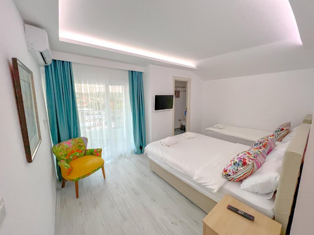 Postel nebo postele na pokoji v ubytování Mercan Otel