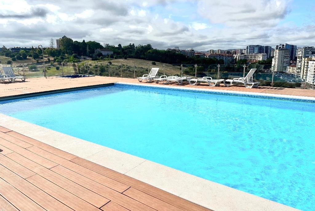 a large swimming pool on top of a building at The Best Lisbon Apartment at The Center with Pool in Lisbon
