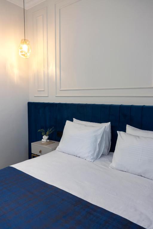 Postel nebo postele na pokoji v ubytování Parvana Guest House