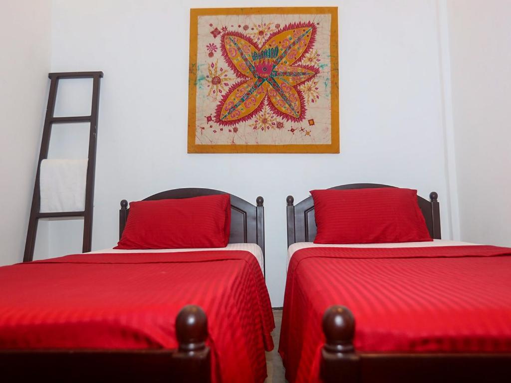 Postel nebo postele na pokoji v ubytování Andiramada Walawwa