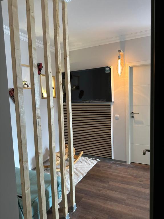 a room with a wall with a flat screen tv at Damien in Bad Bergzabern