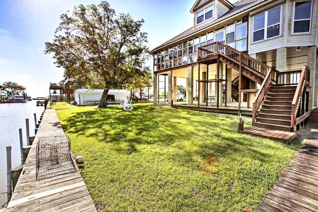 a house on the water with a dock at New Orleans Waterfront Home with Private Dock! in New Orleans