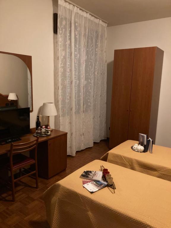 TV a/nebo společenská místnost v ubytování Hotel Banatium B&B Cucina