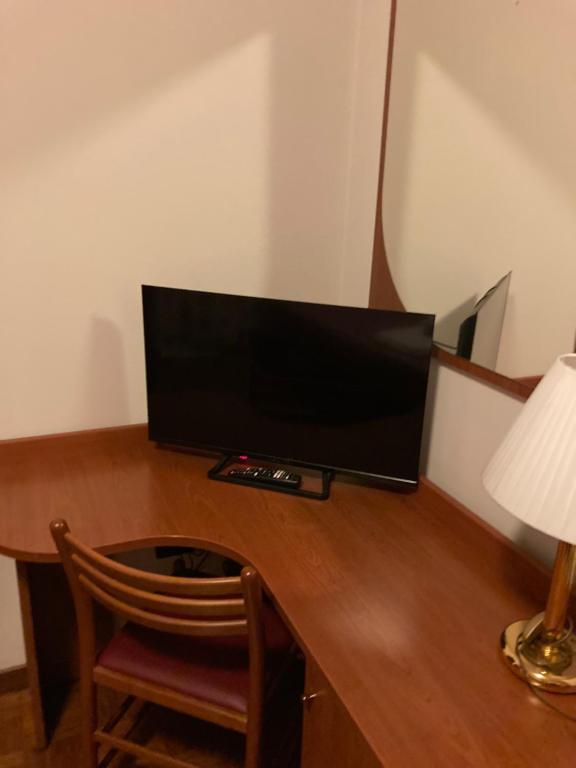 TV a/nebo společenská místnost v ubytování Hotel Banatium B&B Cucina