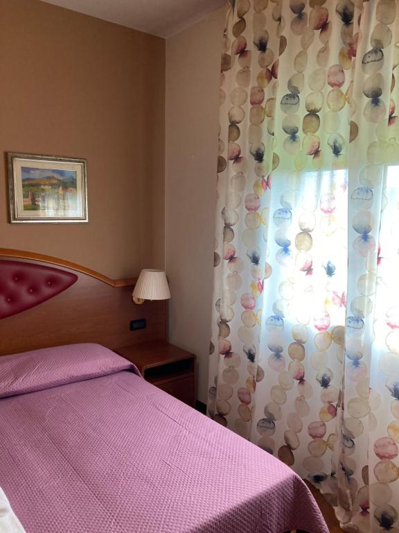 Postel nebo postele na pokoji v ubytování Hotel Banatium B&B Cucina