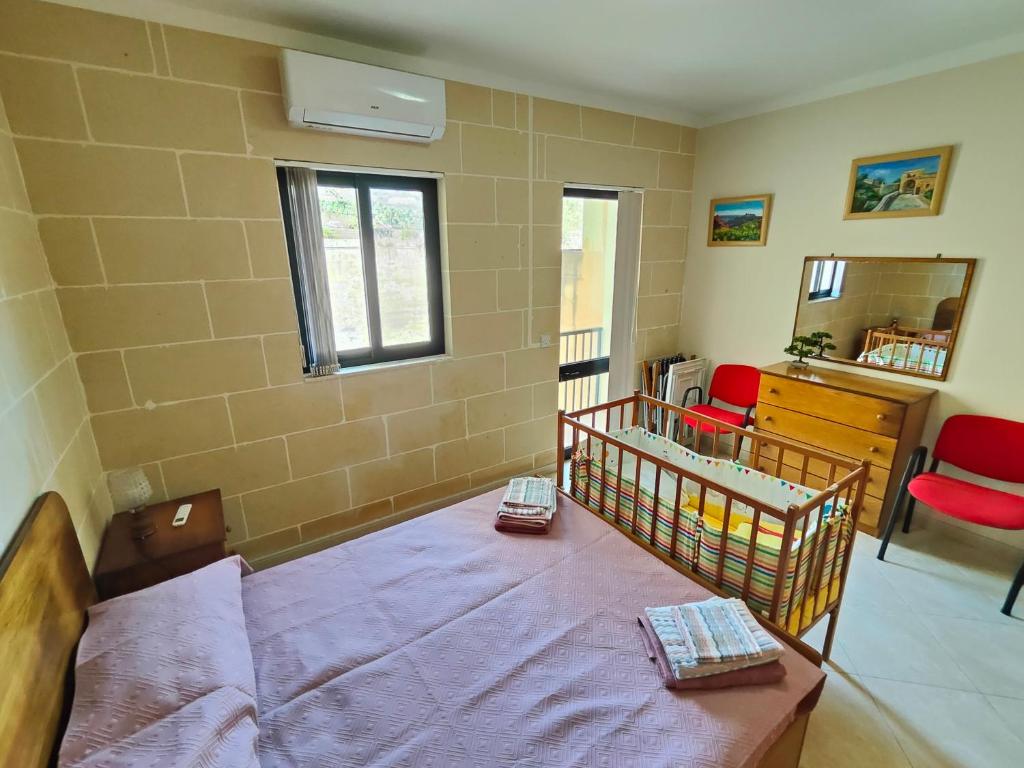 Rúm í herbergi á Seaview Apartment