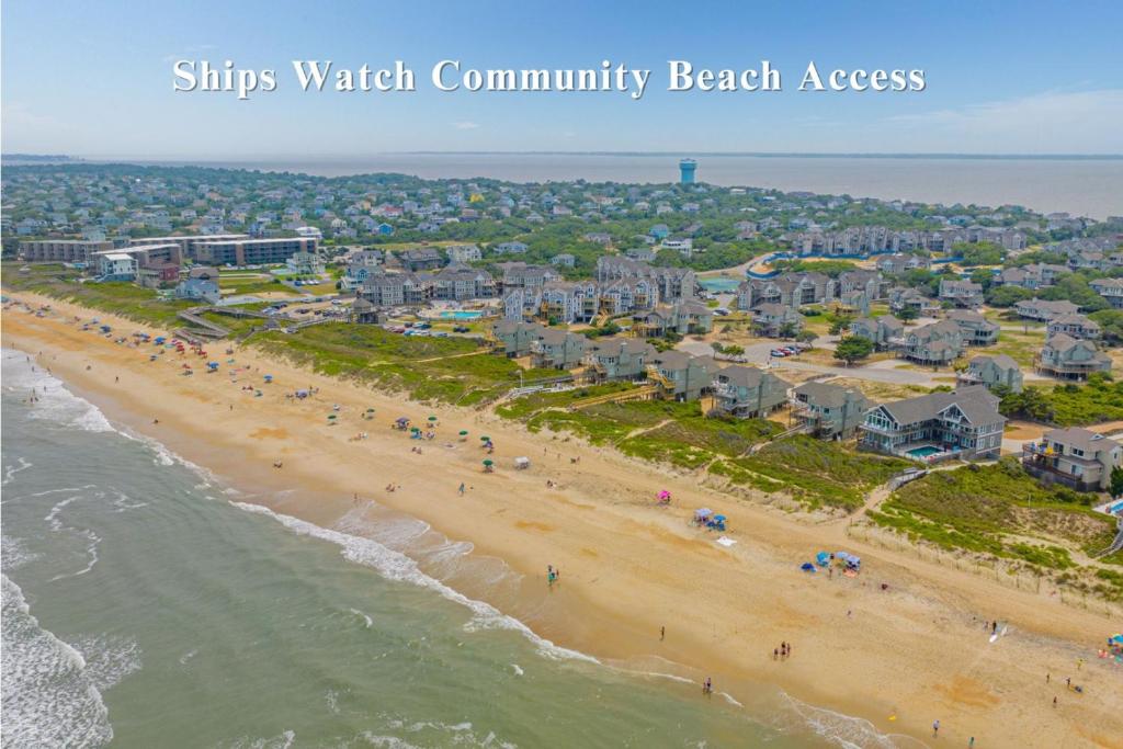 an aerial view of a beach with condos at The Earnest at Ships Watch in Duck