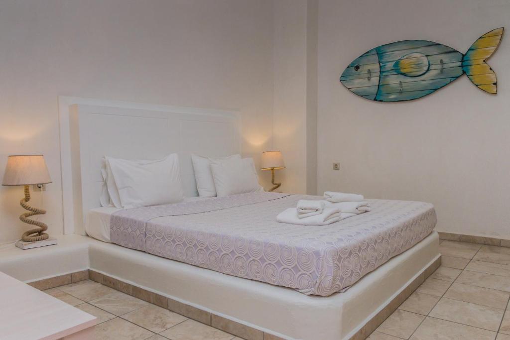 Postel nebo postele na pokoji v ubytování Hotel Sunshine Matala