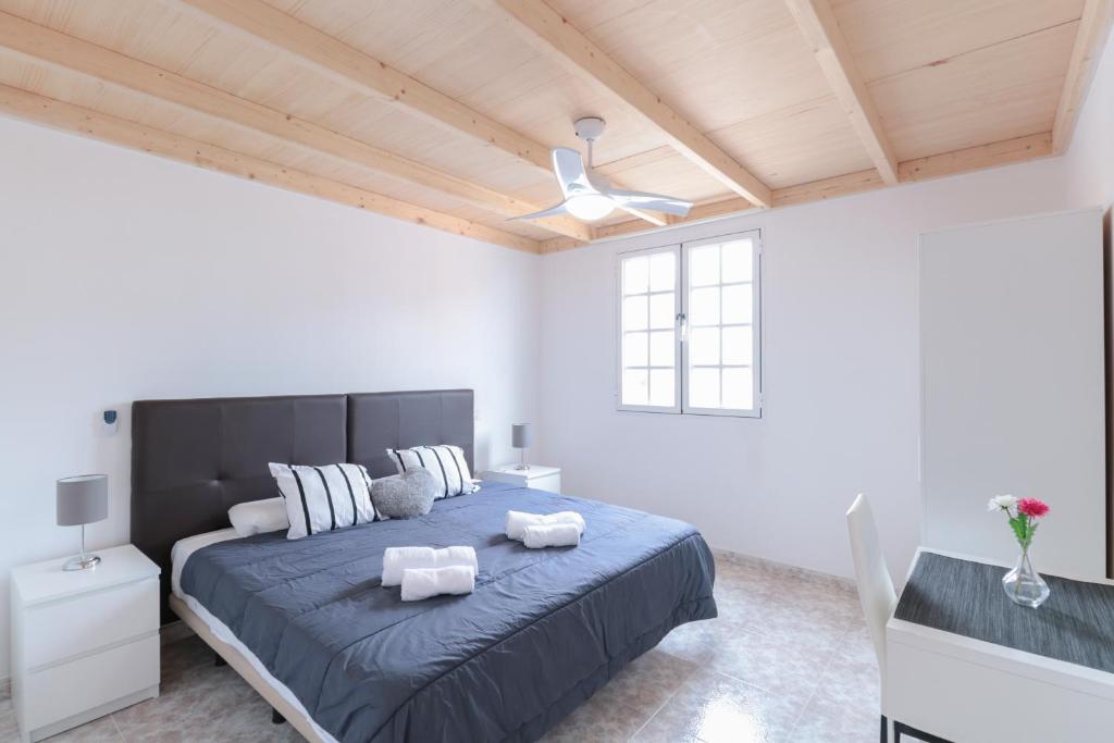Ένα ή περισσότερα κρεβάτια σε δωμάτιο στο Las Palmas Central Rooms
