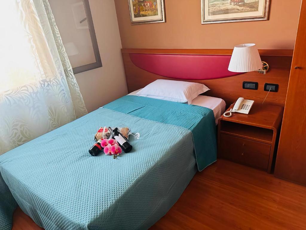 Postel nebo postele na pokoji v ubytování Hotel Banatium B&B Cucina